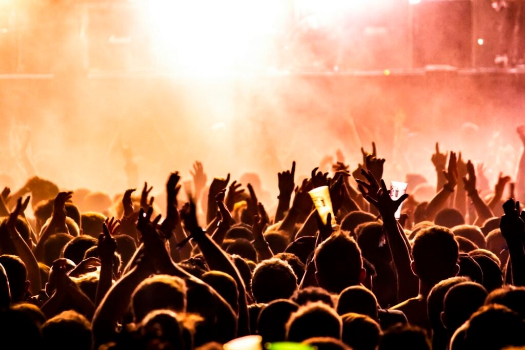 Crowd with hands in the air at a party in Malta