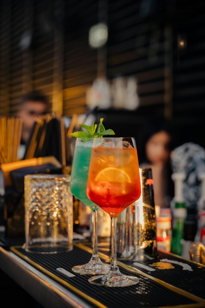 Cocktail on a bar counter at a rooftop bar at night